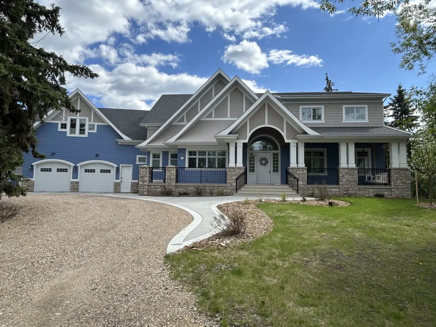 Blue craftsman-style home with fresh siding by PJM Home Advantage